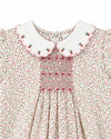 Carriage Boutique baby girl romper with tan floral print, white scalloped collar, and pink smocked diamond detail.