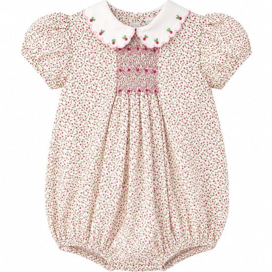 Carriage Boutique baby girl bubble romper in tan floral cotton with pink smocked diamond detail and puff sleeves