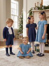 Carriage Boutique toddler and little girl blue suede party dresses with floral patterns and chest ribbon details