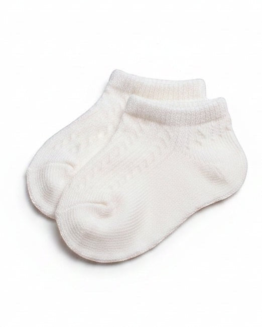 Carriage Boutique white cotton blend ankle socks with diamond pattern and ribbed cuff for baby girls.