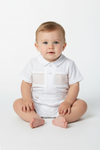 Carriage Boutique white baby boy bobby suit with hand smocked detailing, Peter Pan collar, and satin buttons.