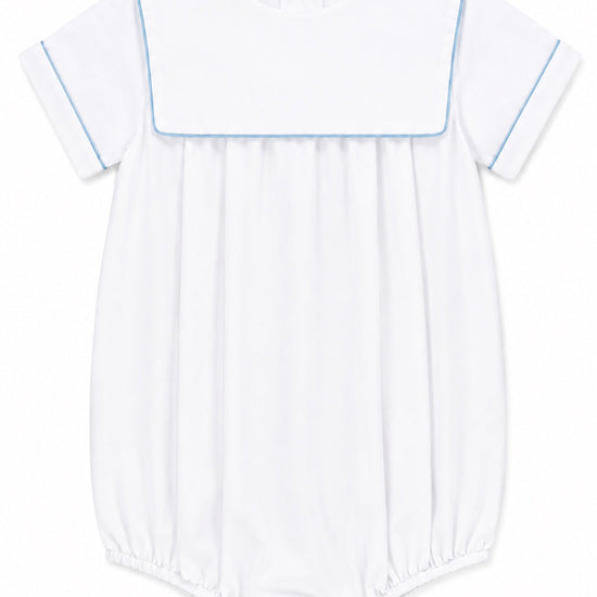 Carriage Boutique white cotton baby boy romper with blue trim, sailor collar, and bottom snaps for easy dressing.