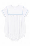 Carriage Boutique white cotton baby boy romper with blue trim, sailor collar, and bottom snaps for easy dressing.