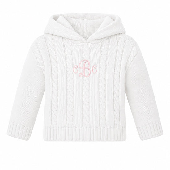 Carriage Boutique white cotton cable knit baby sweater with a hood and custom pink monogram embroidery on the chest.