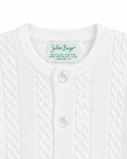 Carriage Boutique white cable-knit cotton baby boy cardigan with button-front closure and crew neckline.