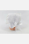 Carriage Boutique white cotton baby bonnet with embroidered cross and scalloped edge, satin ribbon tie.