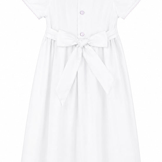 Carriage Boutique white christening gown with pink trim, peter pan collar, and back bow detail for baby girls.