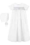 Carriage Boutique white baby boy christening gown with hand-smocked yoke, baby blue bullion cross, and matching bonnet