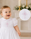 Carriage Boutique baby girl christening gown in white with pink embroidered cross detail and matching bonnet