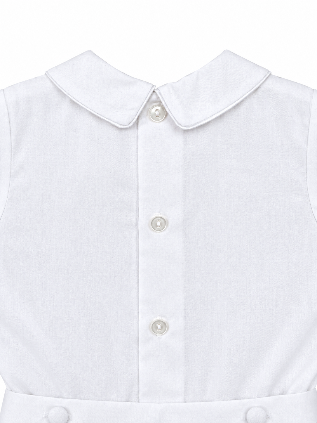 Carriage Boutique white cotton boys bobby suit featuring a Peter Pan collar and elegant satin button detailing.