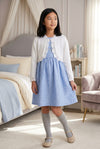 Carriage Boutique white cotton knit bolero shrug with textured pattern and single button closure on a young girl