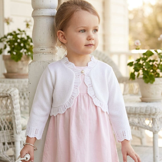 Carriage Boutique white cotton toddler bolero shrug with textured knit pattern and single button closure