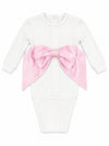 Carriage Boutique newborn white cotton swaddle bag featuring a large satin pink bow on the front