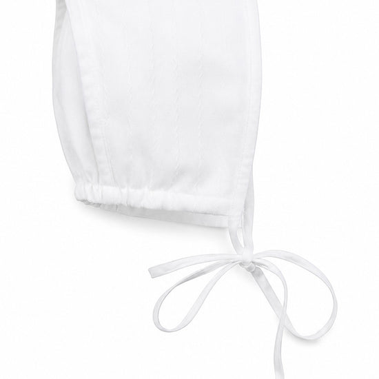 Carriage Boutique white cotton baby christening bonnet with delicate hand embroidery and tie closure