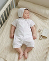 Carriage Boutique white cotton baby boy christening shortall outfit with hand embroidery and matching bonnet