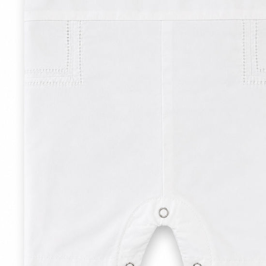 Carriage Boutique white cotton baby boy christening shortall with hand embroidery detail and crotch snaps.