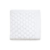Carriage Boutique white 100% cotton baby knit blanket with a textured shell pattern, folded for a nursery.