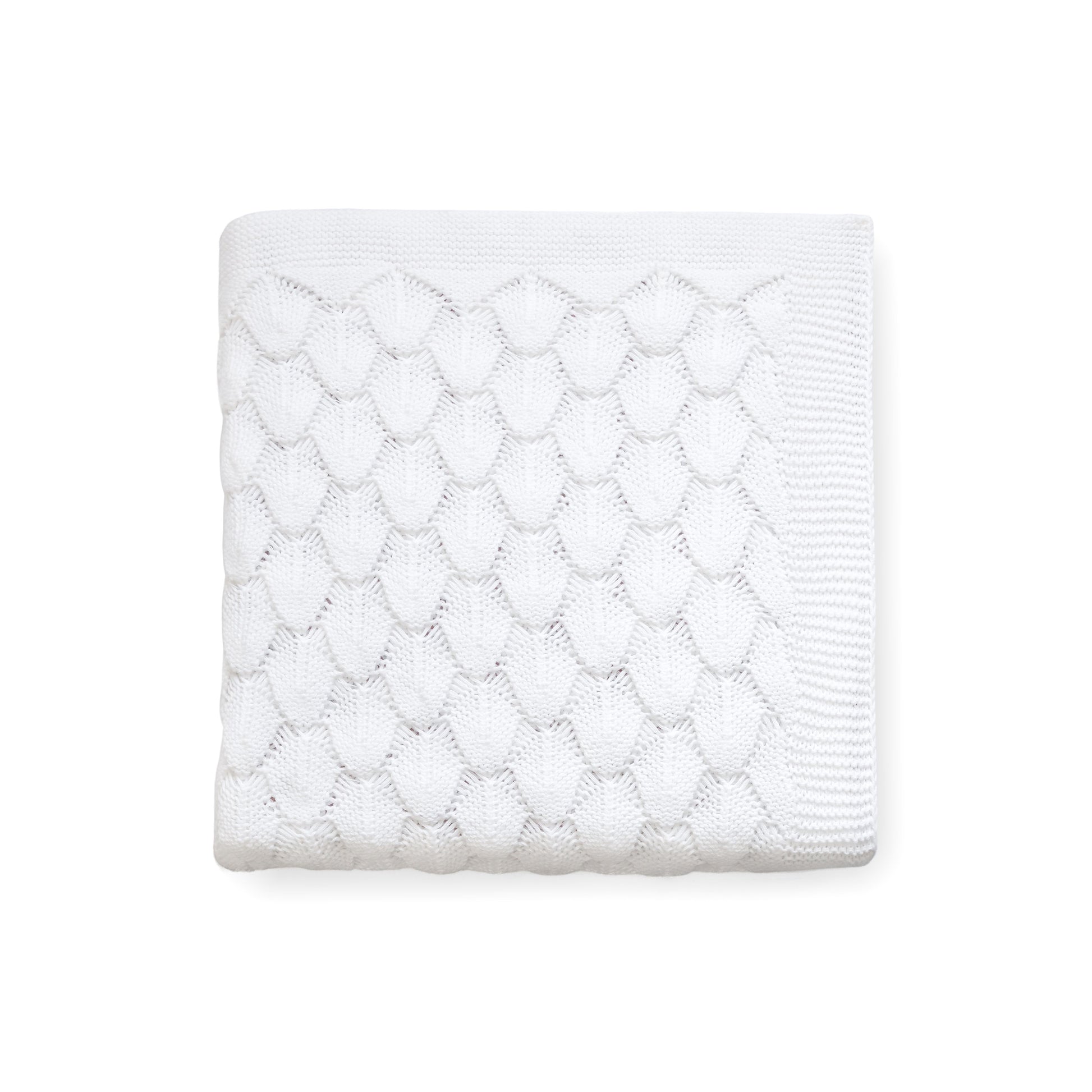 Carriage Boutique white 100% cotton baby knit blanket with a textured shell pattern, folded for a nursery.