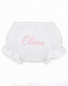 Carriage Boutique white cotton baby diaper cover with pink embroidered name Olivia and delicate lace ruffle trim.
