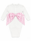 Carriage Boutique white cotton newborn swaddle bag featuring a large pink satin bow and personalized embroidery.