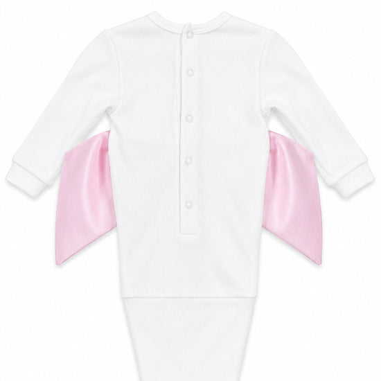 Carriage Boutique white cotton newborn swaddle bag featuring a large pink satin bow on the back and snap closures.