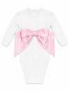 Carriage Boutique newborn white cotton swaddle bag featuring a large satin pink bow on the front