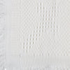 Carriage Boutique white baby blanket featuring a delicate woven cross pattern and elegant fringe trim detail.