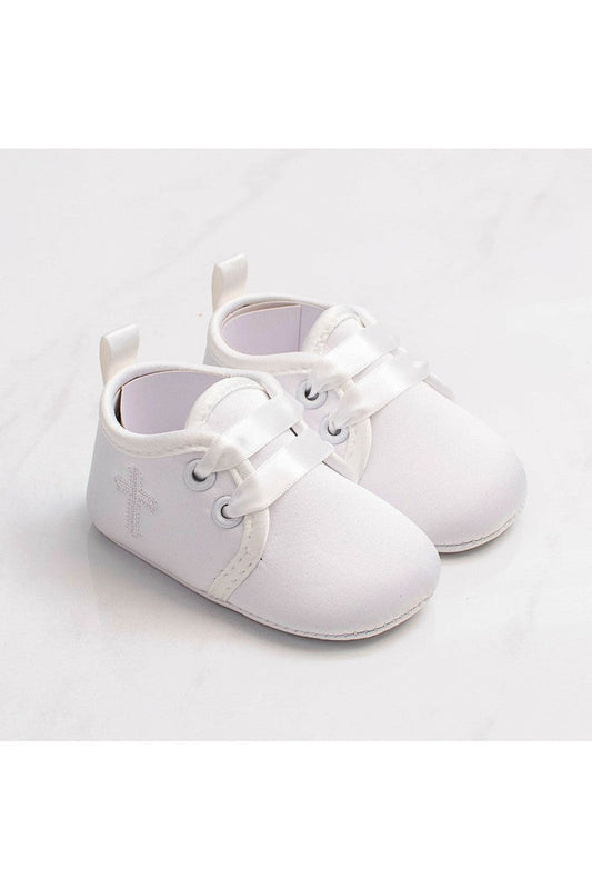 Carriage Boutique white baby christening shoes featuring a delicate embroidered cross and satin ribbon laces.