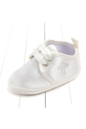Carriage Boutique white baby christening shoes featuring a delicate embroidered cross and satin ribbon laces.