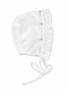 Carriage Boutique white baby bonnet with pink ribbon trim and delicate floral embroidery details