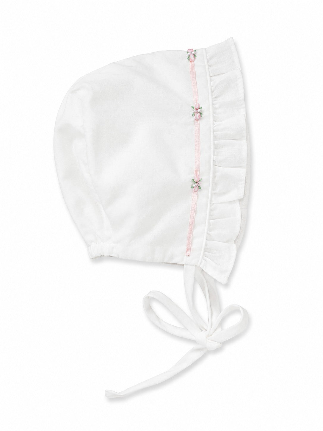 Carriage Boutique white baby bonnet with pink ribbon trim and delicate floral embroidery details