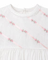 Carriage Boutique white girls gown featuring delicate pink ribbon stripes and floral embroidery with pearl accents.
