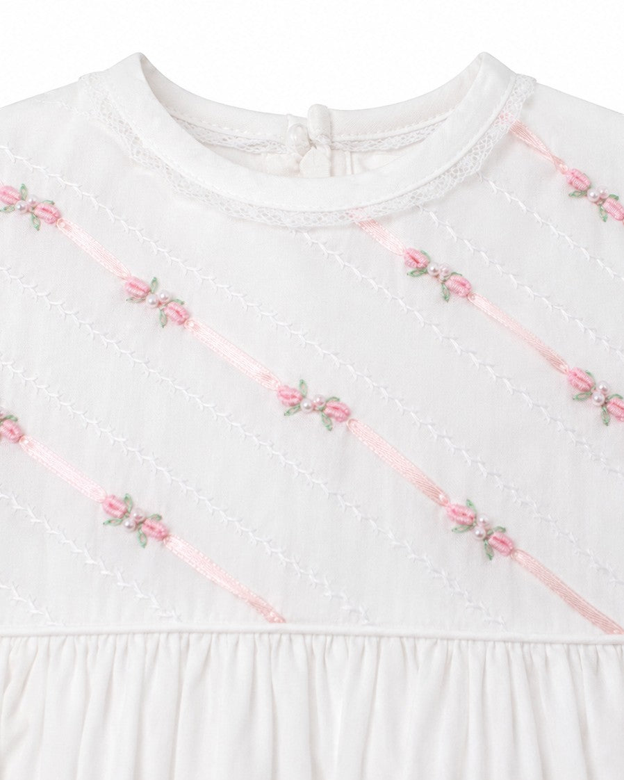 Carriage Boutique white girls gown featuring delicate pink ribbon stripes and floral embroidery with pearl accents.