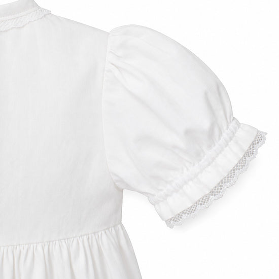 Carriage Boutique white girls gown sleeve detail with delicate lace trim and gathered puff shoulder