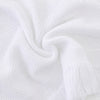 Carriage Boutique white baby blanket with textured knit pattern and delicate fringe trim for a soft elegant look.