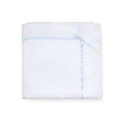 Carriage Boutique Julius Berger white knit baby blanket with blue satin ribbon trim and delicate bow accent