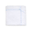 Carriage Boutique Julius Berger white knit baby blanket with blue satin ribbon trim and delicate bow accent