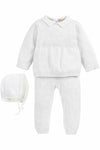 Carriage Boutique white knit baby boy baptism outfit with a collared sweater, matching trousers, and a bonnet.