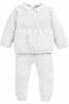 Carriage Boutique white knit baby boy baptism outfit with long sleeves, collared top, and matching knit trousers.