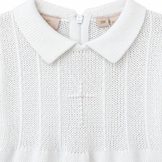 Carriage Boutique white knit cotton christening outfit featuring a collared neckline and embroidered cross with pearl