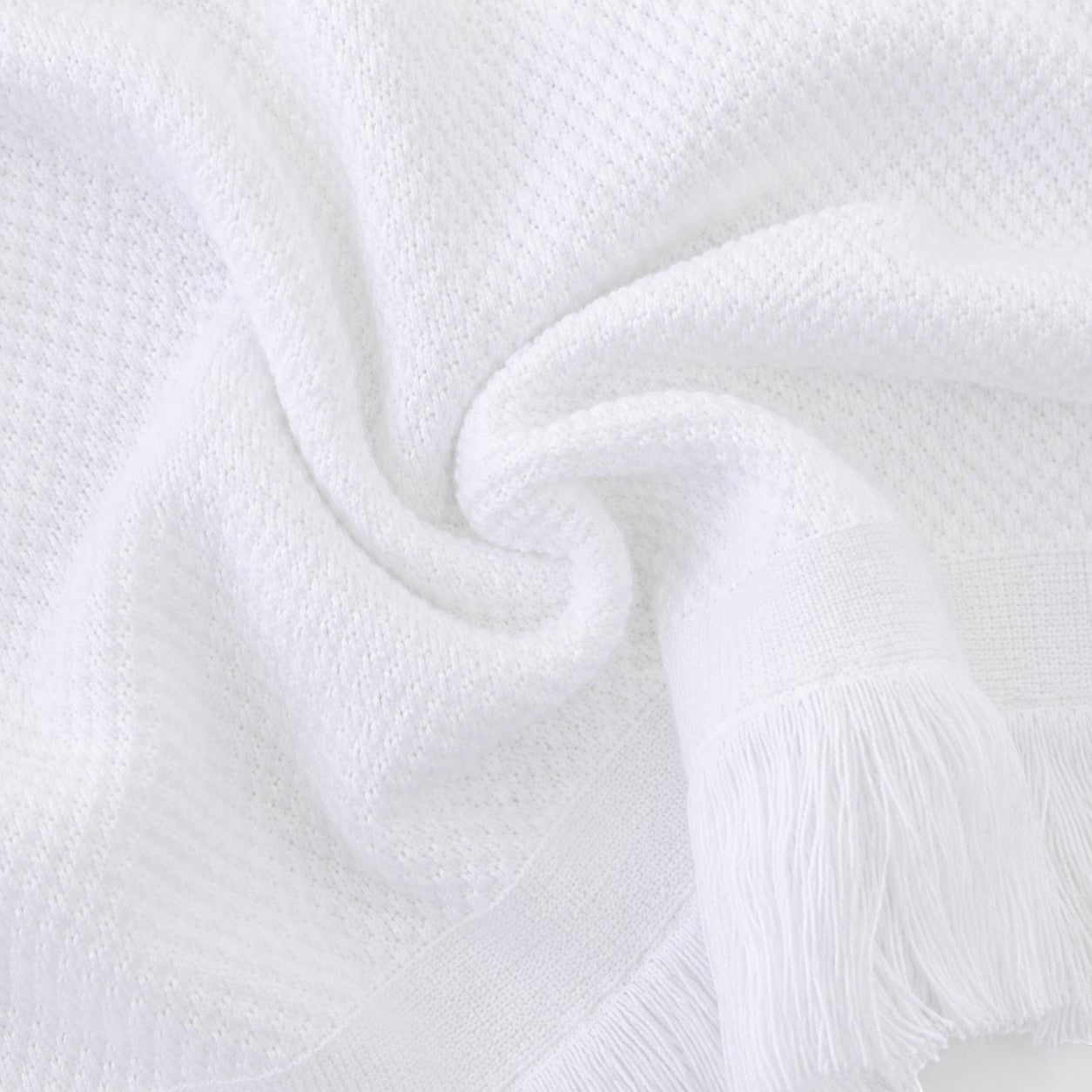 Carriage Boutique white knit baby blanket with soft texture and delicate fringe detail, perfect for monogramming.