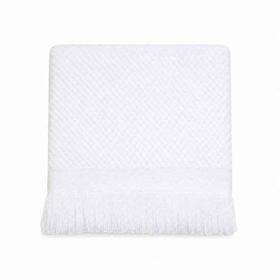 Carriage Boutique white knit baby blanket with textured diamond pattern and elegant fringe trim