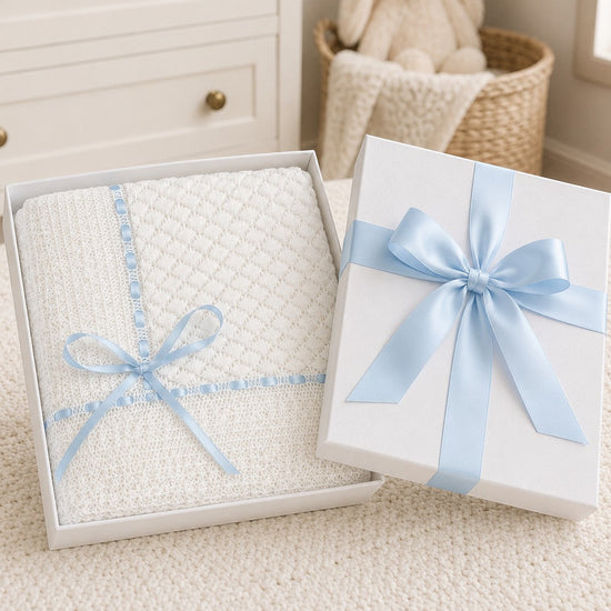 Carriage Boutique white baby blanket with Belgium lace and blue ribbon in a gift box
