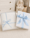 Carriage Boutique white baby blanket with Belgium lace and blue ribbon in a gift box