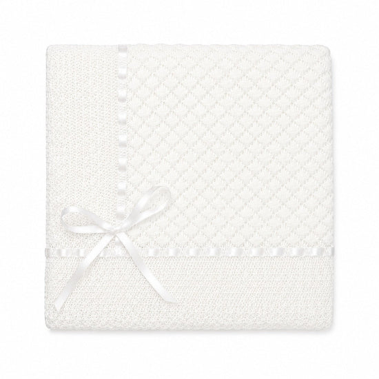 Carriage Boutique white baby blanket featuring delicate Belgium lace trim and a decorative satin ribbon bow.