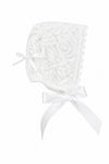 Carriage Boutique white lace baby baptism bonnet with delicate floral patterns and satin ribbon ties.