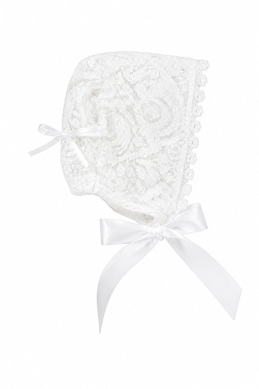Carriage Boutique white lace baby baptism bonnet with delicate floral patterns and satin ribbon ties.
