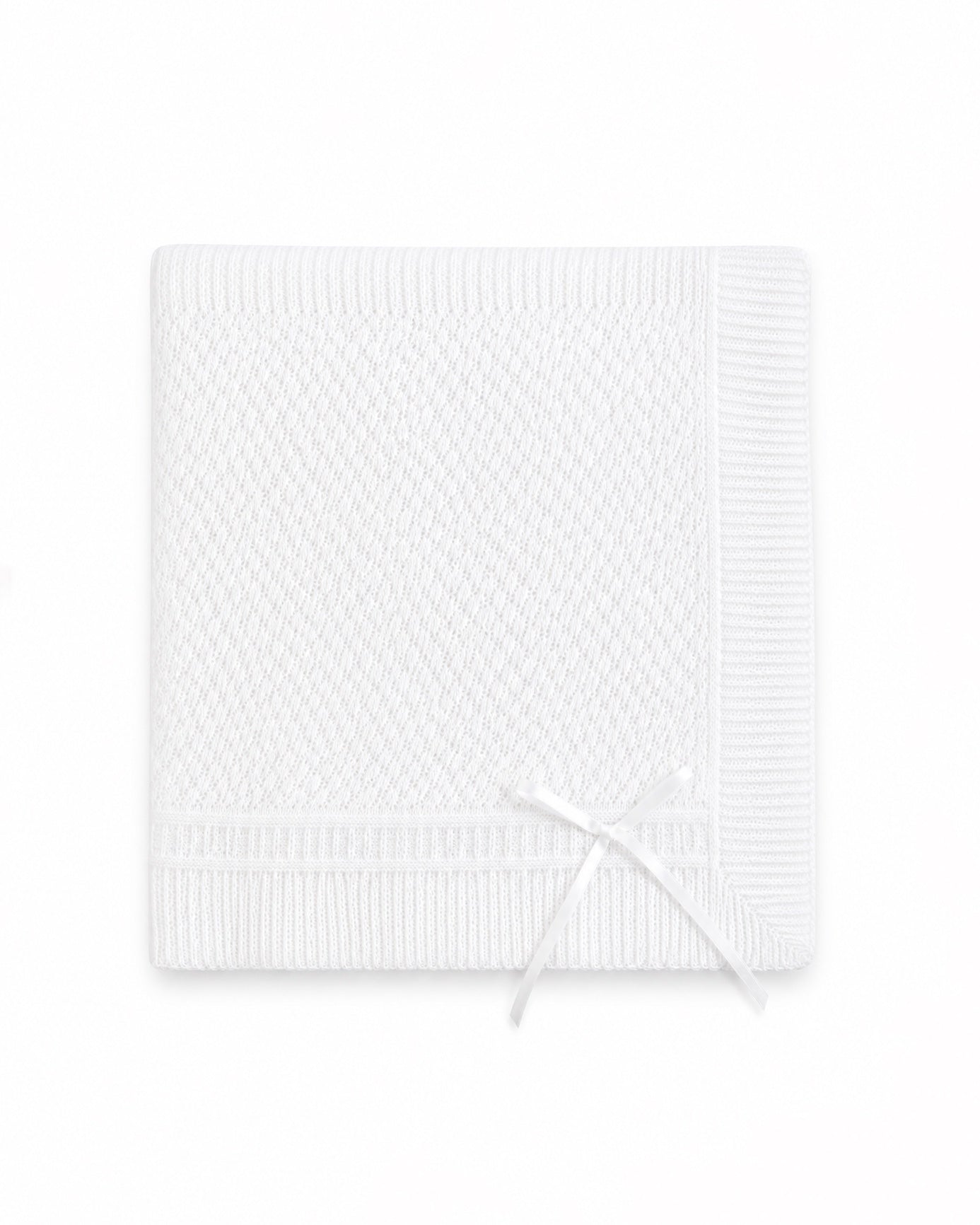 Carriage Boutique white christening blanket featuring delicate Belgium lace texture and a decorative ribbon bow.