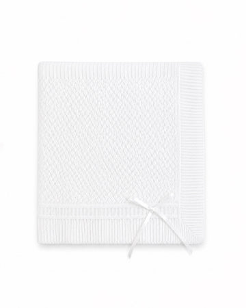 Carriage Boutique white christening blanket featuring delicate Belgium lace texture and a decorative ribbon bow.