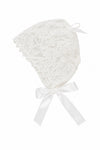 Carriage Boutique white lace christening bonnet with delicate floral patterns and a satin ribbon tie closure.